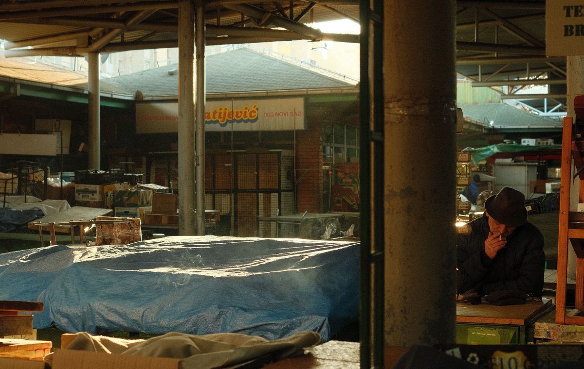 Authentic wholesale market with cartons and vendors